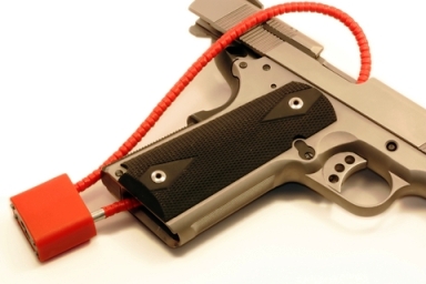 Picture of an Airsoft gun with a safety lock on it.