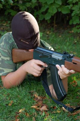 Picture of Airsoft player in woods nearby his home